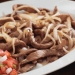 Bisteces encebollados
